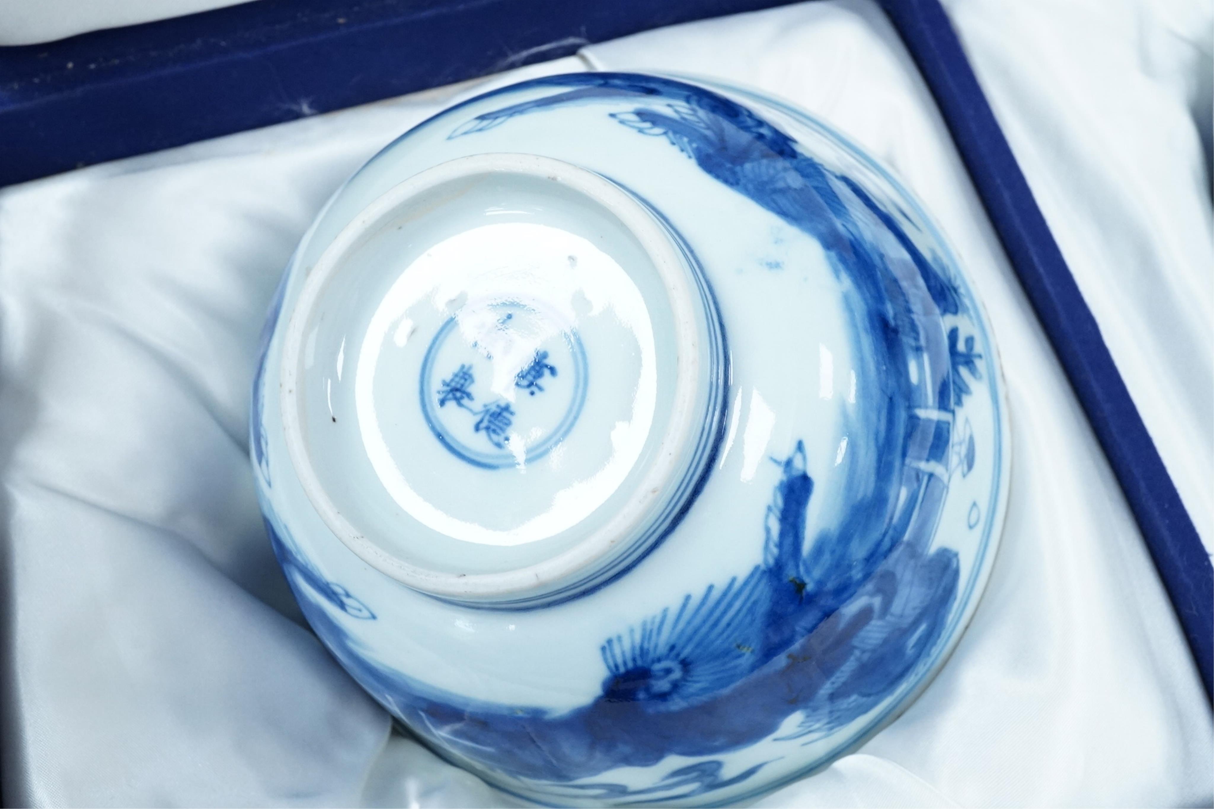 A pair of Chinese Transitional blue and white 'mythical beasts' bowls, early Kangxi period